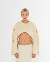 Top à manches arrondies en jean écru de la marque de luxe made in France Raphael de Lacroix